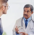 Doctor speaking with patient about prostate cancer treatment options