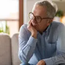 Older man thinking about active surveillance and focal therapy
