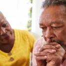 Man with prostate cancer anxiety being comforted by wife