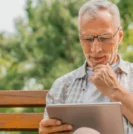 Man reading prostate health news on iPad