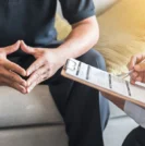 Doctor and patient discussing prostate cancer treatment options