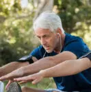 Man and woman stretching outside