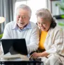 Asian couple on computer